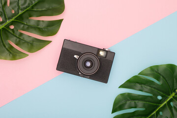 A camera that is in the center of the image and has sheets on the sides.