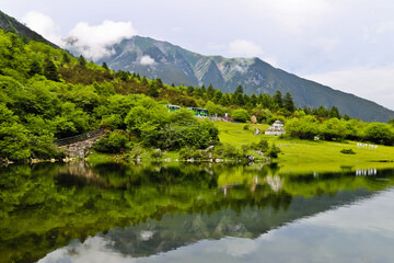 Fototapeta na wymiar Scenic lake of seven-color sea and mountains Kangding Sichuan China