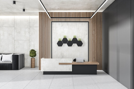 Modern concrete and wooden office lobby interior with reception desk, laptop, decorative plants and other items. 3D Rendering.
