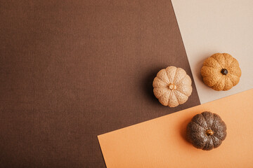 Flat lay with handmade painted gypsum pumpkins and copy space. Autumn holidays, thanksgiving, halloween geeting card, invitation mockup
