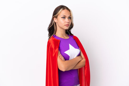 Teenager Russian girl isolated on white background in superhero costume with arms crossed