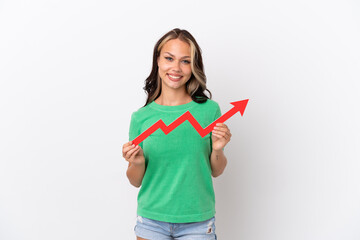 Teenager Russian girl isolated on blue background holding a catching a rising arrow with happy expression