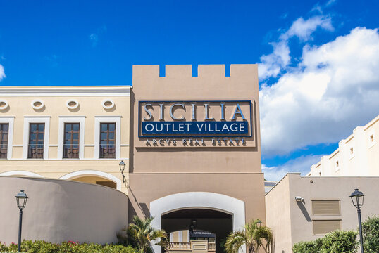 Agira, Italy - May 6, 2019: Entrance to Sicilia Outlet Village shopping center near Agira town