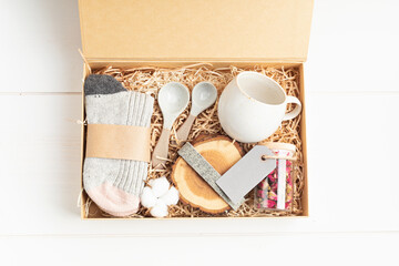 Preparing care package, seasonal gift box with plastic free, zero waste products. Personalized eco...