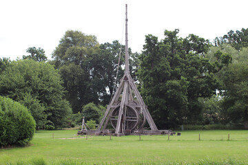 Trebuchet of the Warwick Castle surrounded by greenery in the daylight in the UK