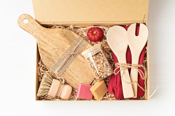 Preparing care package, seasonal gift box with plastic free, zero waste kitchen utensils....