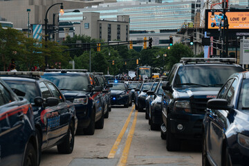 Police cars line street ahead of protest