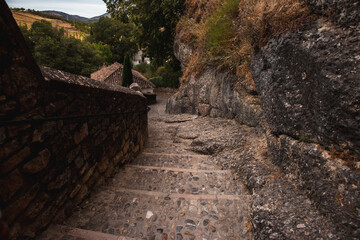 descent of ancient stone stairs