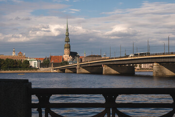 View of the Stone Bridge and St. Peter's Church in Riga, capital city of Latvia, European baltic country