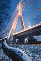 Poland, Subcarpathia, Rzeszow, Suspension bridge at night in winter