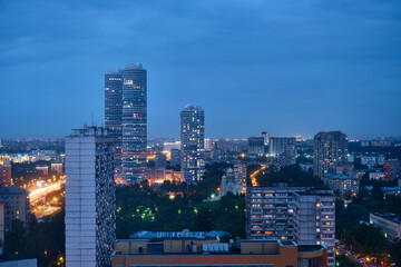 Naklejka premium Moscow, Russia - May 26, 2021: Night view from the Cosmos Hotel on the buildings of the city of Moscow. The surroundings around VDNKh and Ostankino TV Tower.