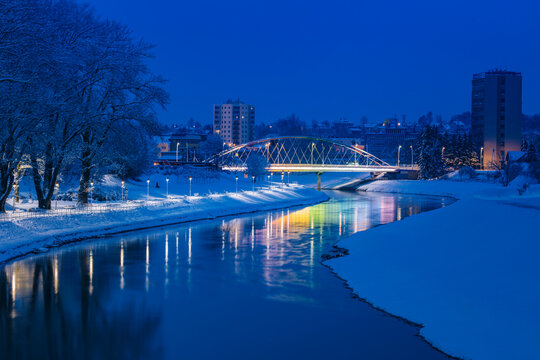 Poland, Subcarpathia, Rzeszow, Illuminated bridge at night in winter