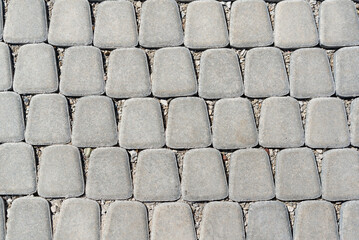 Tiles in the city. Laying new tiles outdoors. Sidewalk path.