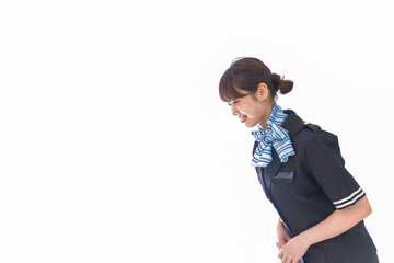 お辞儀をするキャビンアテンダント