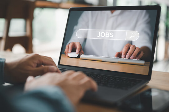 job search concept, man browsing work opportunities online using job search computer app. find your career, man looking at online website by laptop computer.