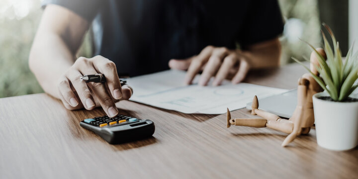 A businesswoman examines a financial chart in order to make arrangements. Investment concept for a business fund. vintage fillter