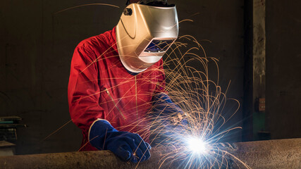 Banner photo of worker welding the steel part by manual. steel industrial, welding, repairing...