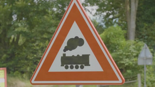 Unguarded level crossing warning sign