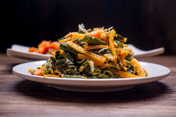 made with boiled vegetables dressed with spiced grated coconut topping called Urap