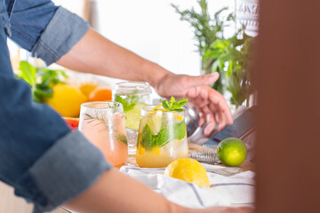 Mixologist making refreshing cocktails with hard seltzer at home