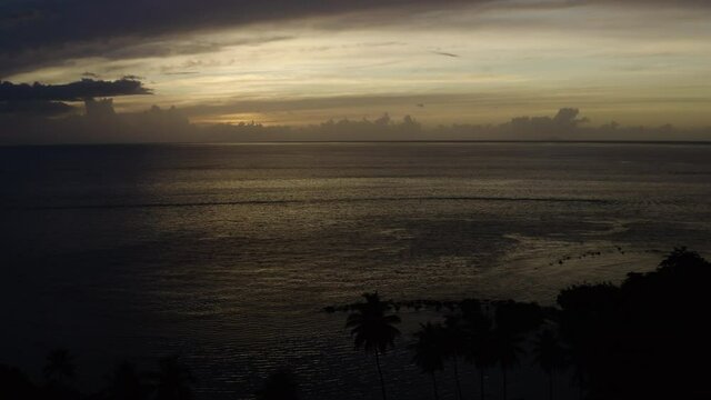 Beautiful aerial sunset over Punta Ostiones Puerto Rico. Cinematic late afternoon footage over the Caribbean. 