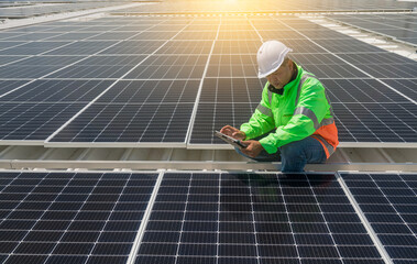 Engineer wearing unifrom and helmet inspect and check solar cell panel ,solar cell is ecology...