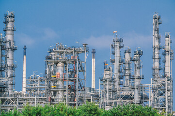 Fototapeta premium Industrial zone,The equipment of oil refining,Close-up of industrial pipelines of an oil-refinery plant,Detail of oil pipeline with valves in large oil refinery.