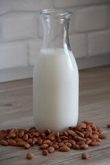 Almond milk in a glass bottle. Healthy and natural. For vegetarians.