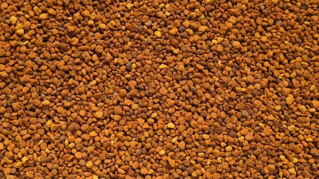 propolis background. Honey products. Beekeeping product. honey propolis granules close-up. Honey and pollen. High quality 4k footage