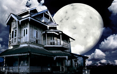 Haunted house. Old abandoned house on night sky background