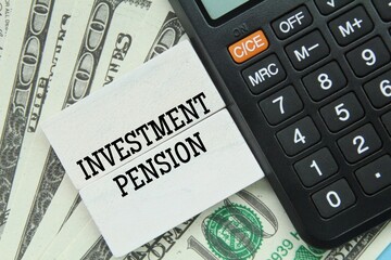 calculator, paper money with the word investment pension