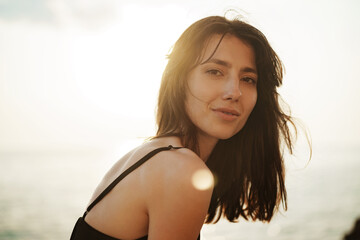 Young smiling woman outdoors portrait at beach