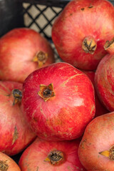 Group of pomegranates closeup, selective focus.