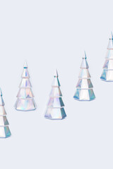 Christmas tree from holographic paper, New Year holiday background with colorful figures fir tree