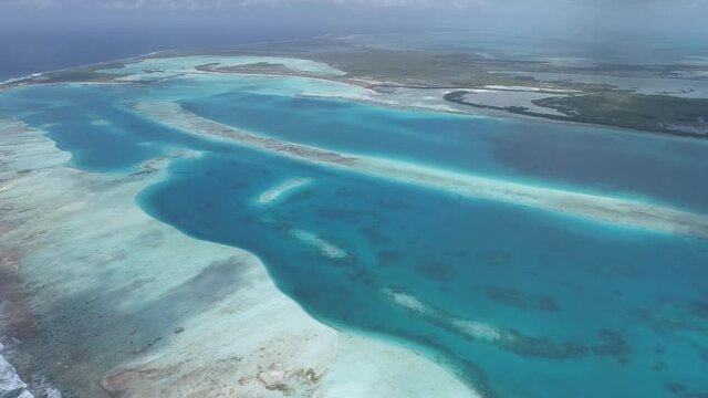 Moving-turn rigth aerial view esta coral reef  barrier and-shallow-turquoise waters in the Caribbean sea in SEBASTOPOL Los-roques