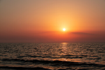 The sun reflecting in the sea water after sunrise