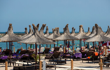 Umbrellas on the beach in Saturn resort - Romania 02.Aug.2021 Black sea beach on a summer day
