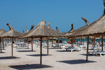 Umbrellas on the beach in Saturn resort - Romania 02.Aug.2021 Black sea beach on a summer day
