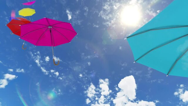 Multicolored umbrellas flying high to the sky against the sun with the wind. 3d rendering animation with colourful red yellow blue parasols fly by air at the windy weather. Hot summer autumn concept.