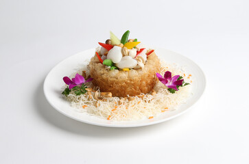 deep fried crispy taro yam ring with stir fried scallop and vegetables in white background asian halal menu
