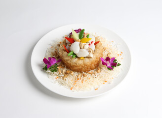 deep fried crispy taro yam ring with stir fried scallop and vegetables in white background asian halal menu