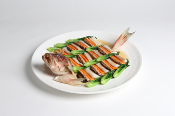 steamed whole fish grouper seafood fillet in 2 way style and vegetable in white background asian halal menu