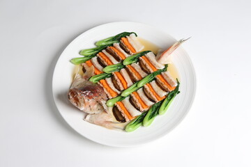 steamed whole fish grouper seafood fillet in 2 way style and vegetable in white background asian halal menu