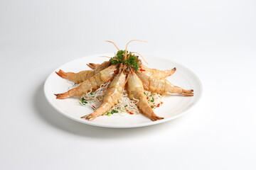 deep fried crispy big fresh tiger prawn in spicy chilli curry sauce in hot clay pot in white background asian halal menu