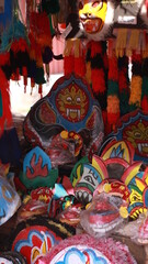 various unique masks lined up in a market. Unique and cool