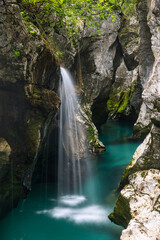 Fototapeta na wymiar Waterfall in beautiful river soca near bovec in Slovenia