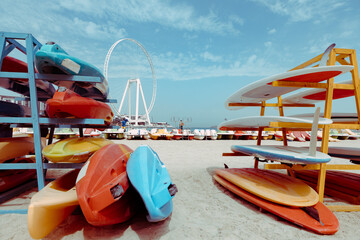 Surfboards stacked on the rack on a beach