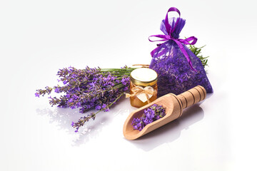 Obraz na płótnie Canvas Bottle with aroma oil and lavender flowers isolated on white background