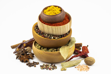 Wooden bowls with spices, isolated on a white background.