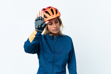 Young blonde Uruguayan cyclist woman isolated on background making stop gesture and disappointed